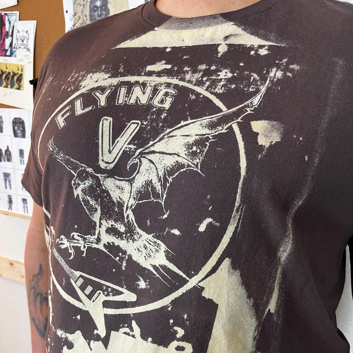 Closeup of eagle clutching Flying V guitar – screen-printed detail